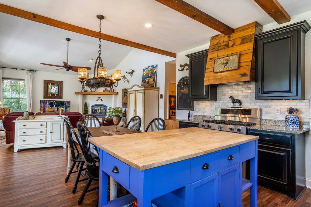 1681 Marrestop Road Murphy, NC 28906 - Photo 12 of 53 a kitchen with stainless steel appliances granite countertop a kitchen island a stove a table and chairs