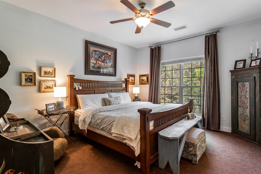 1681 Marrestop Road Murphy, NC 28906 - Photo 21 of 53 a bedroom with a bed and a chandelier