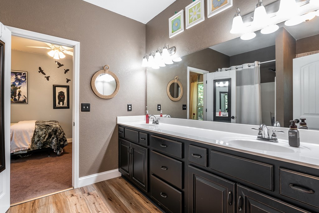 1681 Marrestop Road Murphy, NC 28906 - Photo 25 of 53 a bathroom with a double vanity sink and a mirror