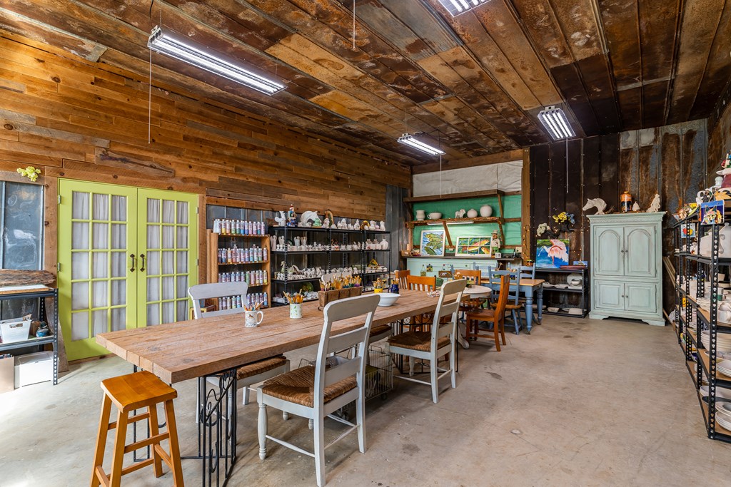 1681 Marrestop Road Murphy, NC 28906 - Photo 30 of 53 a dining room with furniture and a floor to ceiling window