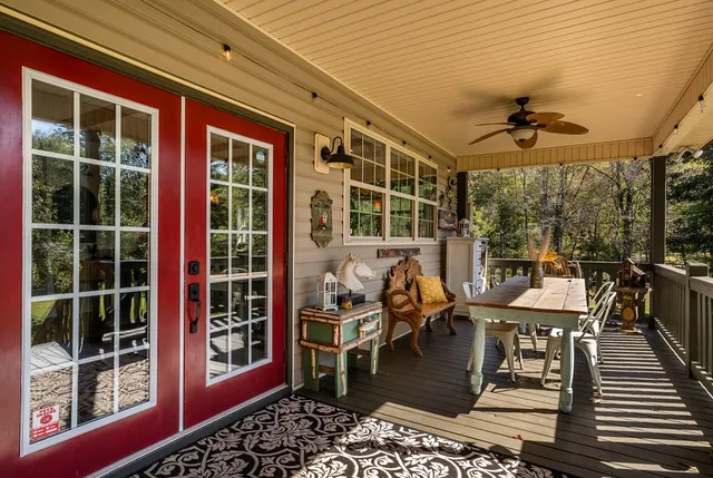 a kitchen that has a lot of furniture and a stove