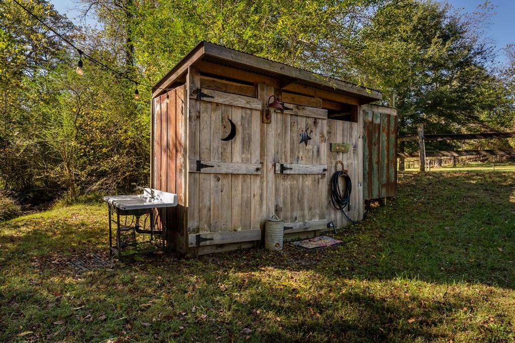 1681 Marrestop Road Murphy, NC 28906 - Photo 48 of 53 a view of a small house with a small yard and large trees