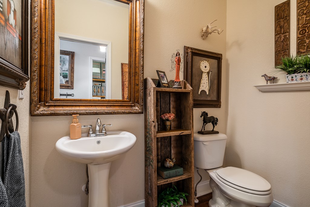 1681 Marrestop Road Murphy, NC 28906 - Photo 8 of 53 a bathroom with a toilet sink and mirror