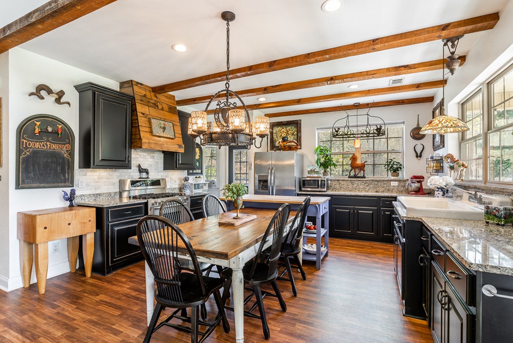 1681 Marrestop Road Murphy, NC 28906 - Photo 10 of 53 a kitchen with a table chairs stove and cabinets