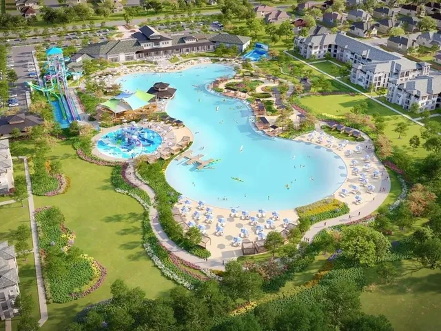 an aerial view of a swimming pool a yard and lake view