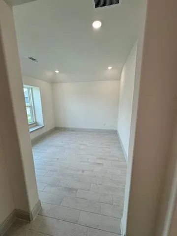 en empty room with windows