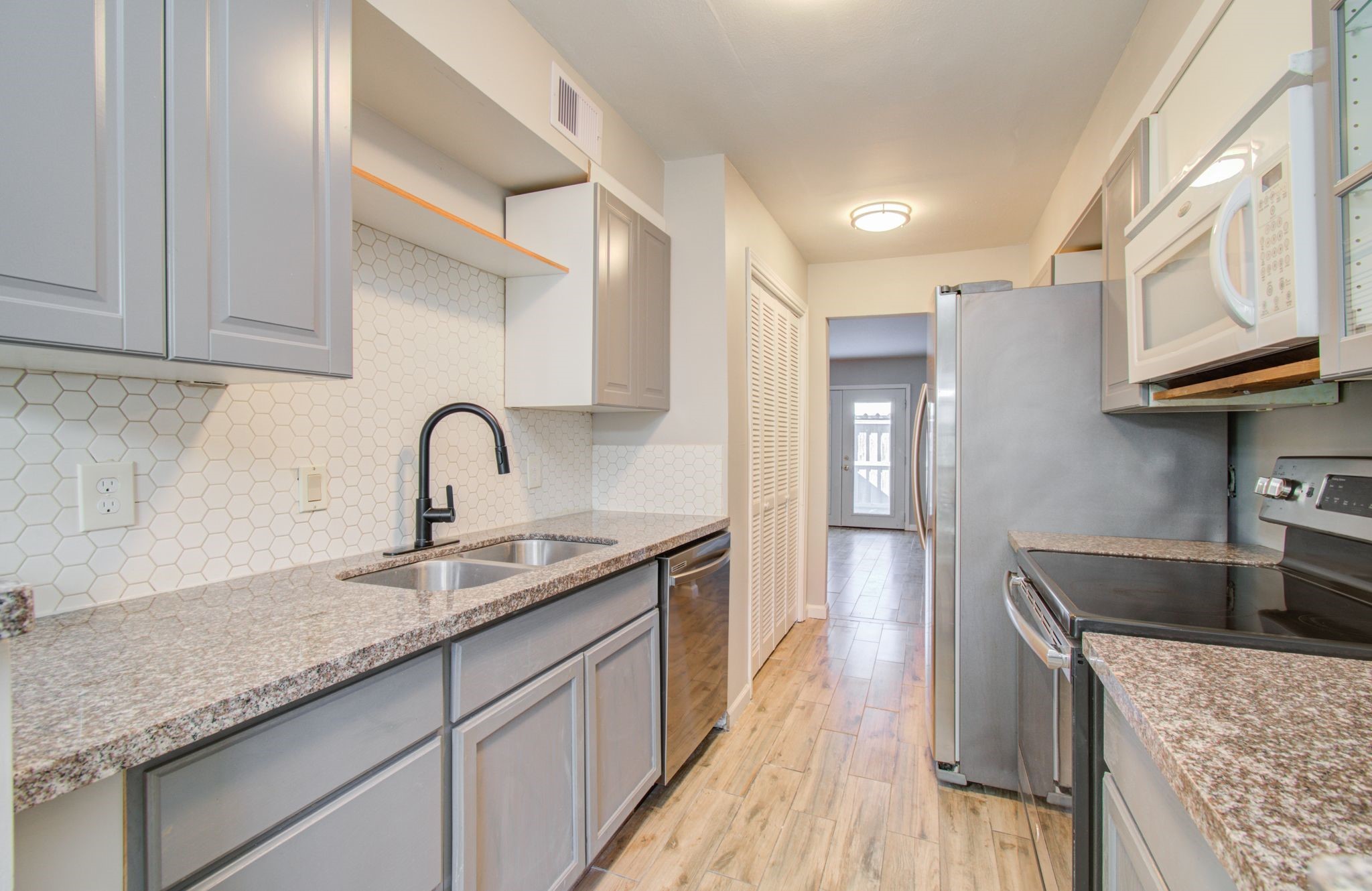 9495 Fondren Road Houston, TX 77074 - Photo 7 of 27 View of the kitchen with stainless steel appliances