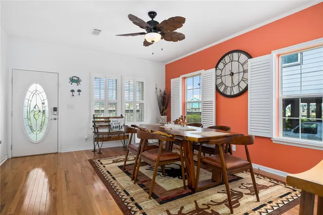 a view of a dining room with furniture window and wooden floor