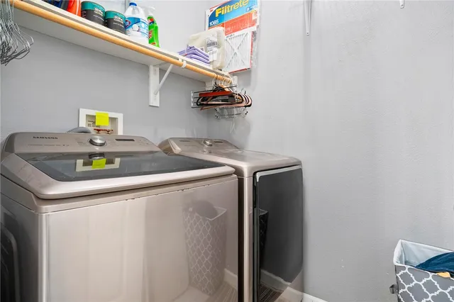 a utility room with dryer and washer