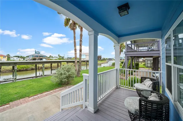 a view of a deck with two chair and a table