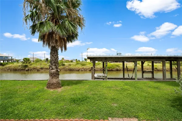 a view of swimming pool with a yard and lake view