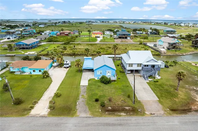 an aerial view of a house with a garden