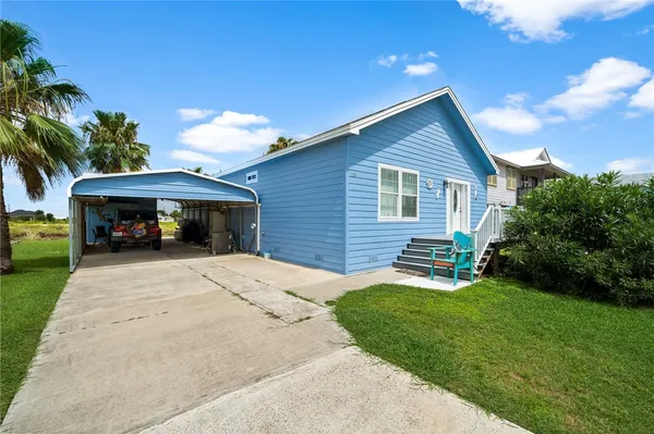 a front view of a house with a yard and porch