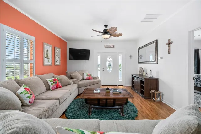 a living room with furniture and a flat screen tv