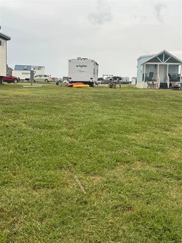 a large body of water with a building in the background