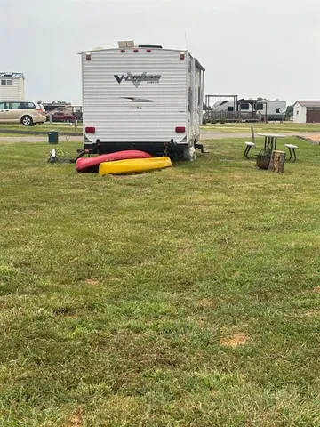 a swimming pool with outdoor seating and yard