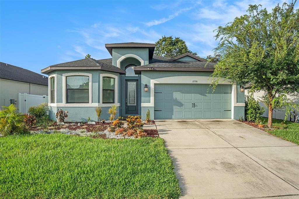 front view of a house with a yard