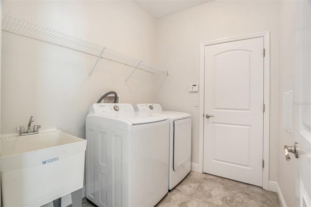 12330 Newt Court New Port Richey, FL 34654 - Photo 13 of 30 a utility room with dryer and washer