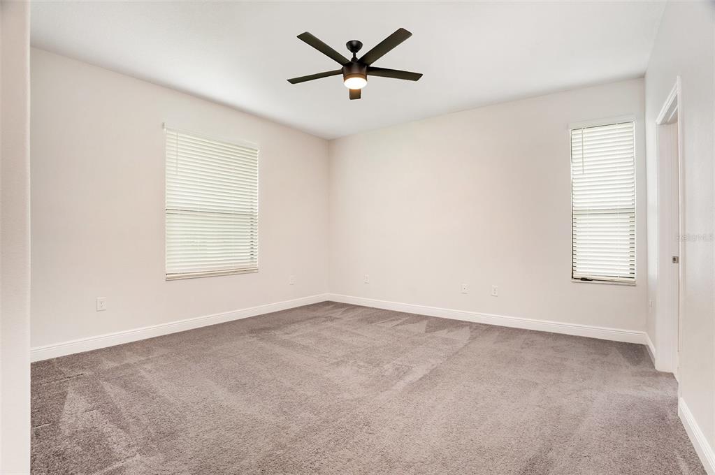 12330 Newt Court New Port Richey, FL 34654 - Photo 14 of 30 an empty room with window and a ceiling fan