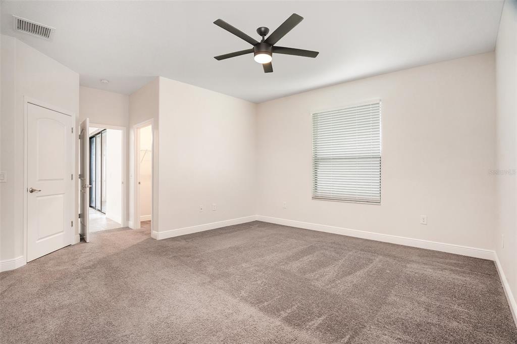 12330 Newt Court New Port Richey, FL 34654 - Photo 15 of 30 an empty room with window and a ceiling fan