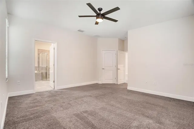 a bathroom with a granite countertop sink mirror and shower