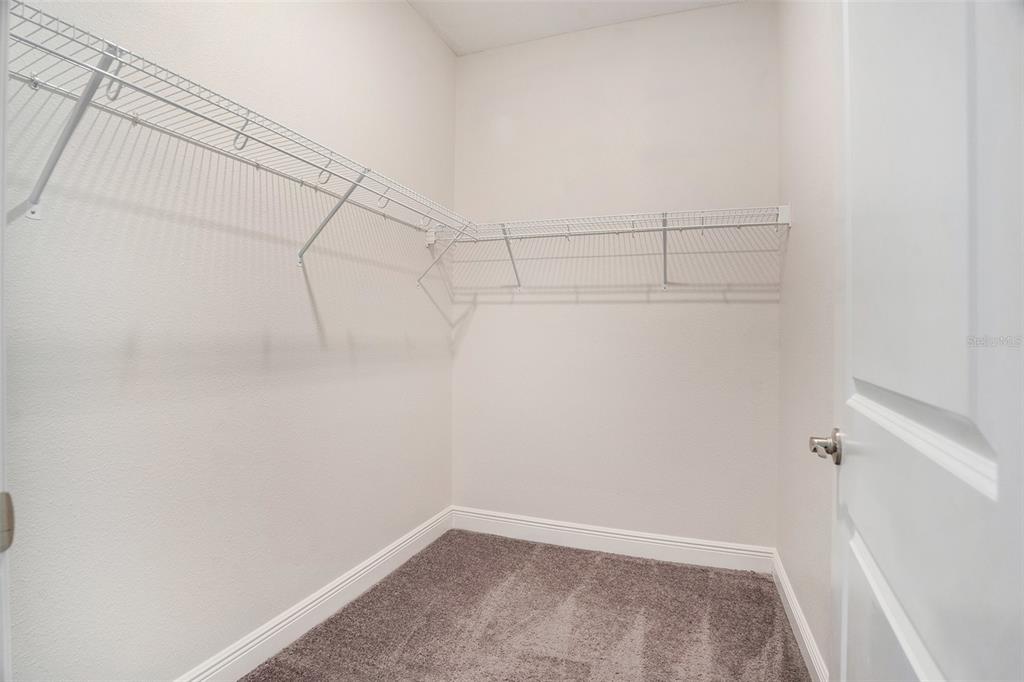 12330 Newt Court New Port Richey, FL 34654 - Photo 18 of 30 a view of a room with racks on the wall