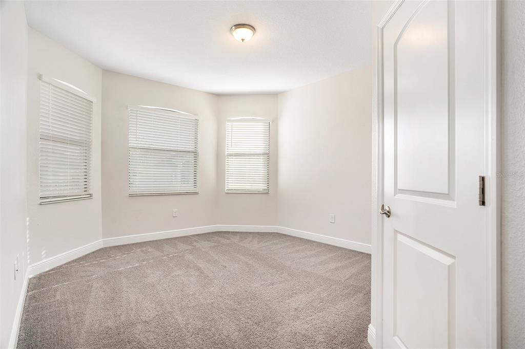 12330 Newt Court New Port Richey, FL 34654 - Photo 22 of 30 an empty room with windows and closet