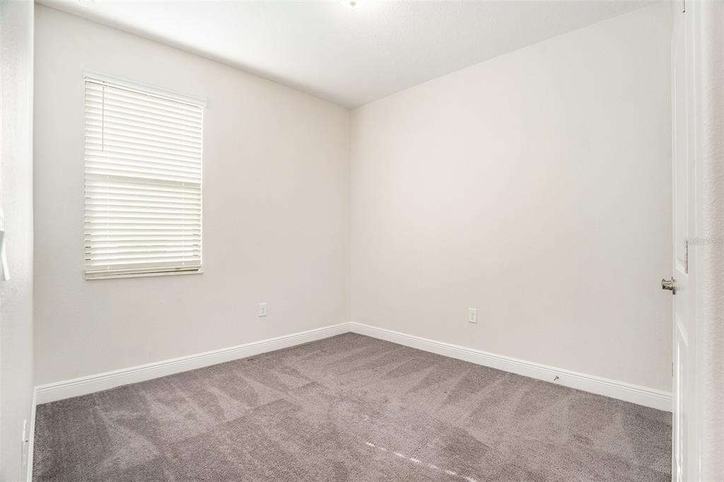 12330 Newt Court New Port Richey, FL 34654 - Photo 24 of 30 an empty room with a window