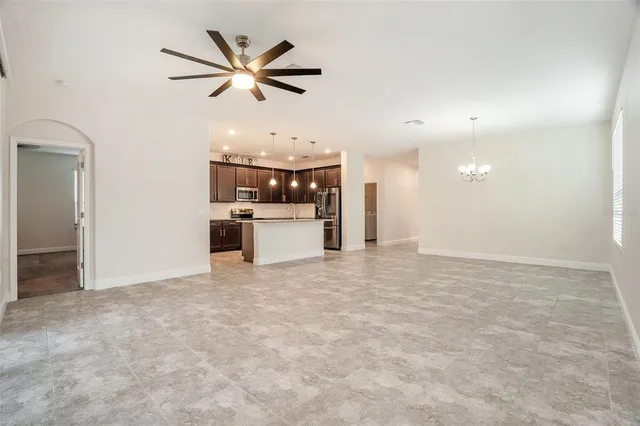 a view of a kitchen with a sink and a refrigerator
