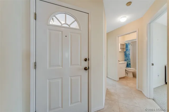 a view of empty room with windows