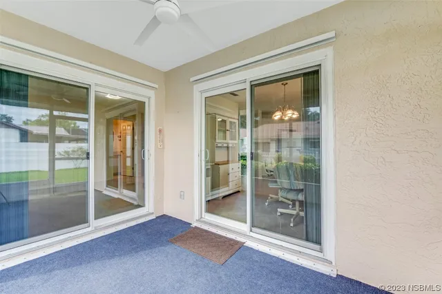 a view of a livingroom with furniture and a window