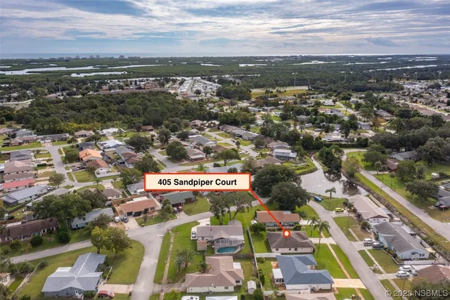 an aerial view of residential building with parking space