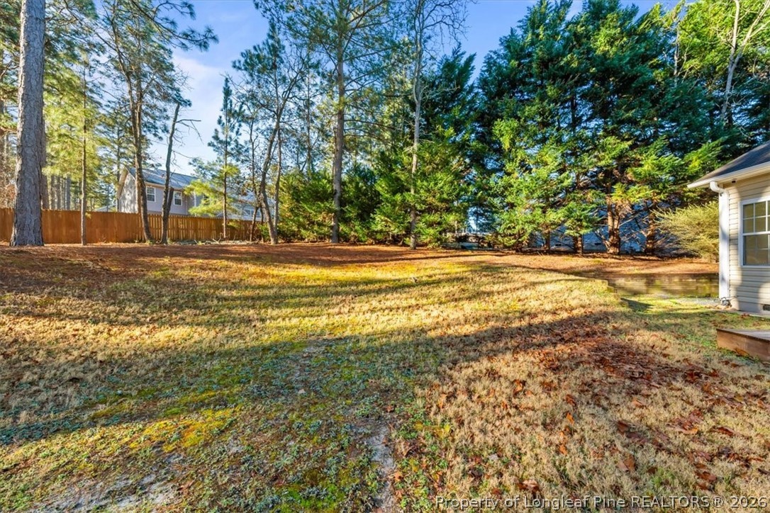 60 Spring Lake Drive Pinehurst, NC 28374 - Photo 39 of 42 a view of a yard with a tree