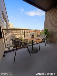 a view of a chairs and table in patio