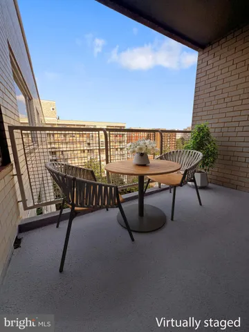 a view of a chairs and table in patio