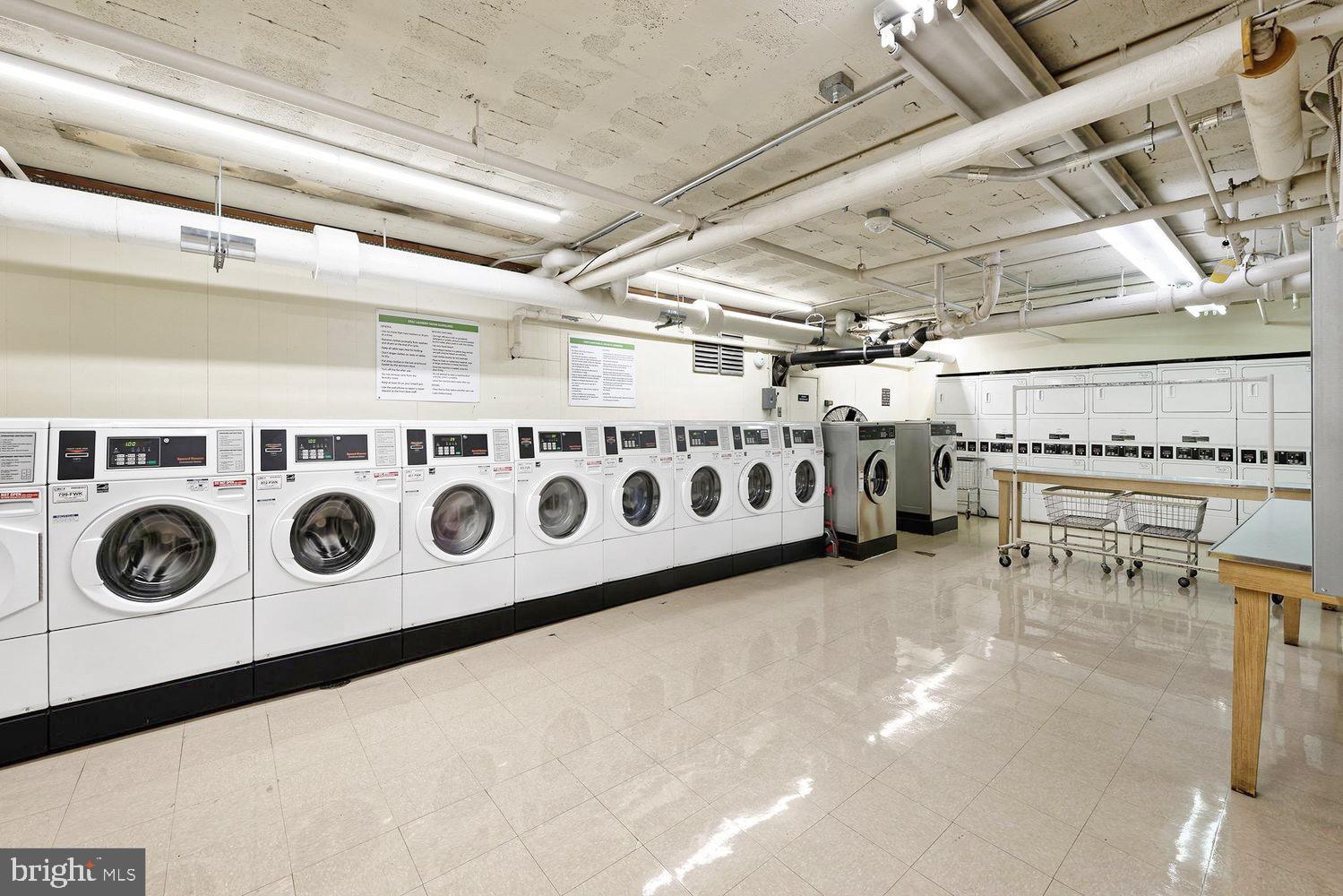 2475 Virginia Avenue Northwest, Unit 917 Washington, DC 20037 - Photo 20 of 21 a utility room with stainless steel appliances and cabinets