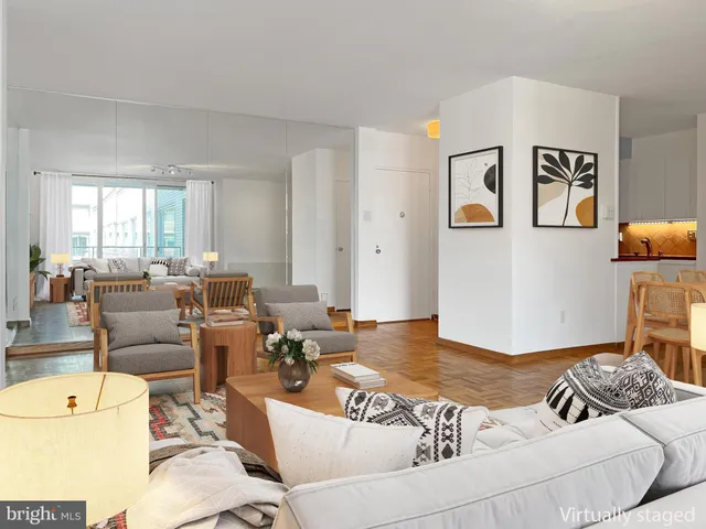 a living room with furniture and a table