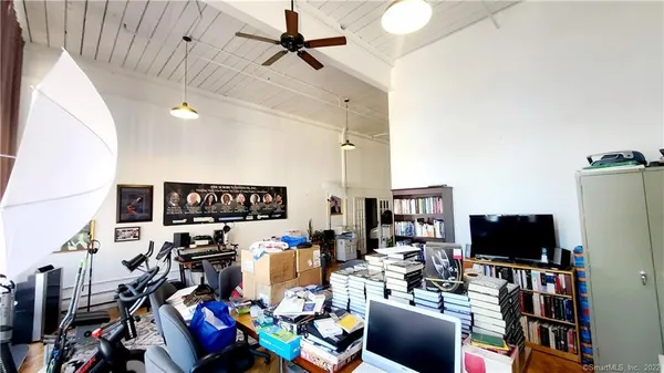 a living room with lots of furniture and black flat screen tv