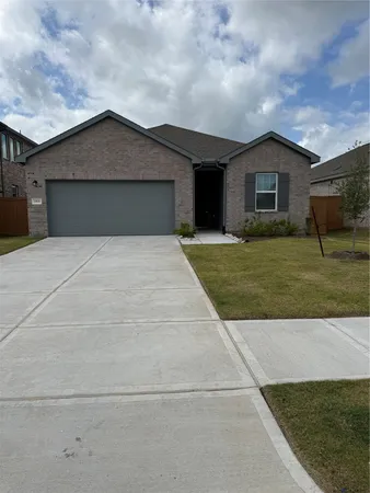 a front view of a house with yard