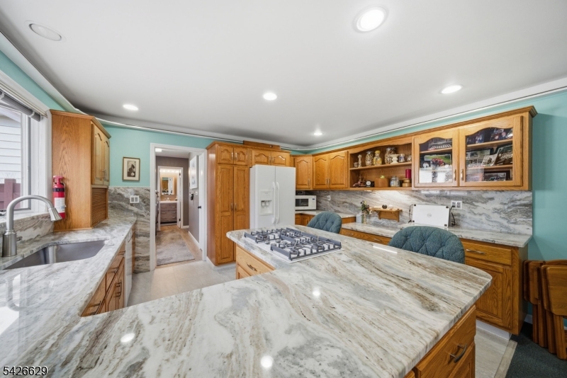42 Schoolhouse Road Randolph, NJ 07869 - Photo 11 of 49 a large bedroom with a large bed a couch and dresser
