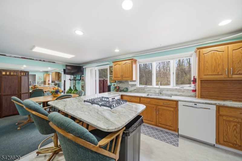 42 Schoolhouse Road Randolph, NJ 07869 - Photo 12 of 49 a open kitchen with a table and chairs in it