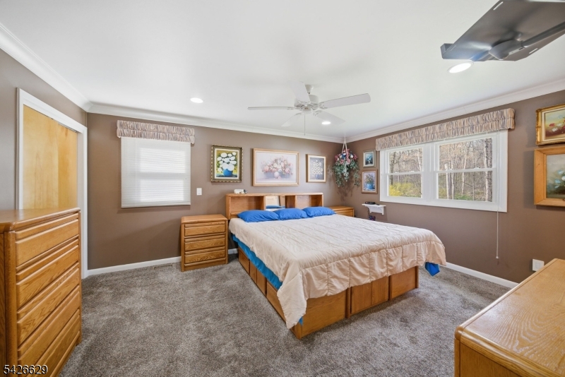 42 Schoolhouse Road Randolph, NJ 07869 - Photo 14 of 49 a bed room with a bed and a window