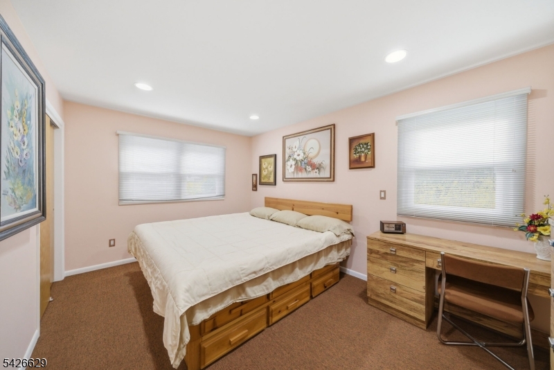 42 Schoolhouse Road Randolph, NJ 07869 - Photo 17 of 49 a bed room with a bed and a window
