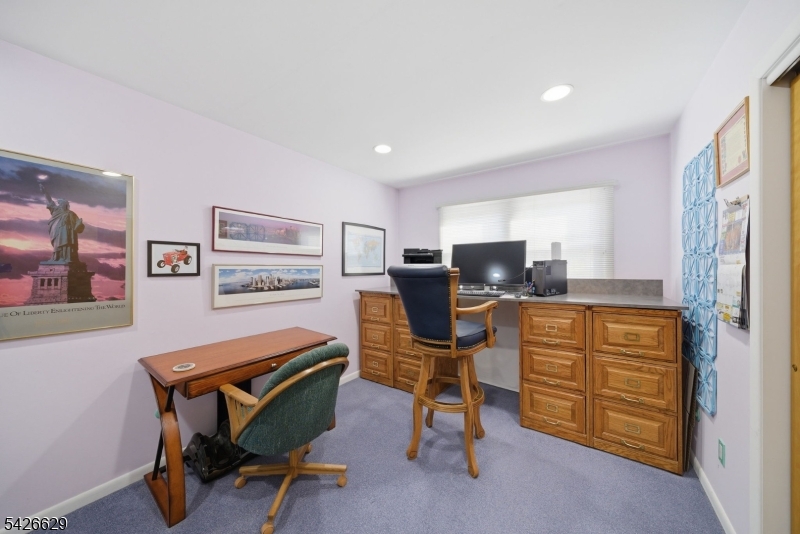 42 Schoolhouse Road Randolph, NJ 07869 - Photo 19 of 49 a room with furniture and a window