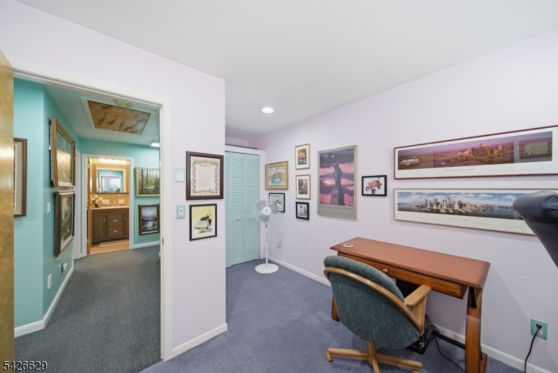 42 Schoolhouse Road Randolph, NJ 07869 - Photo 20 of 49 a living room with furniture and painting on the wall
