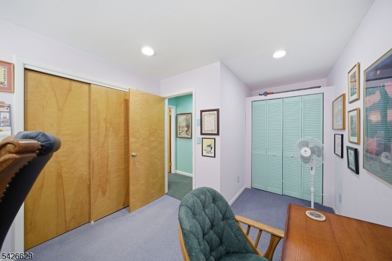42 Schoolhouse Road Randolph, NJ 07869 - Photo 21 of 49 a bedroom with a bed and a dresser