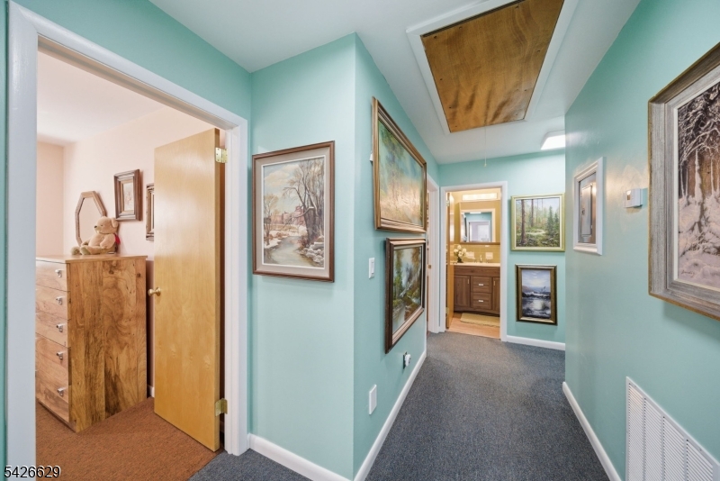 42 Schoolhouse Road Randolph, NJ 07869 - Photo 22 of 49 a view of a hallway with windows and brick walls