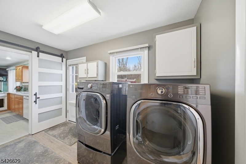 42 Schoolhouse Road Randolph, NJ 07869 - Photo 25 of 49 a utility room with sink dryer and washer