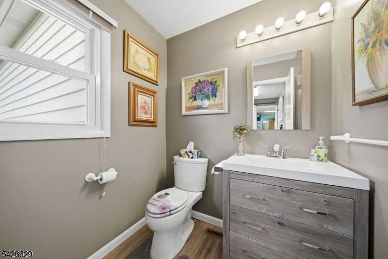 42 Schoolhouse Road Randolph, NJ 07869 - Photo 26 of 49 a bathroom with a toilet a sink and mirror