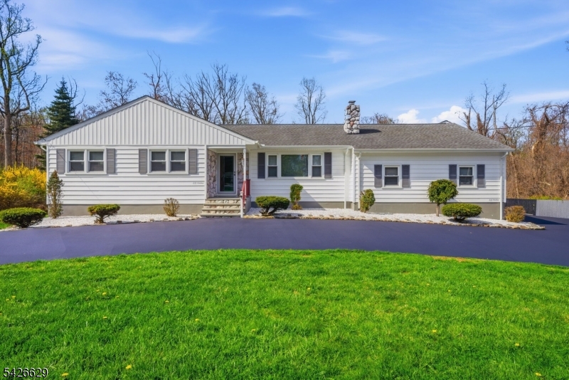 42 Schoolhouse Road Randolph, NJ 07869 - Photo 3 of 49 a front view of a house with a yard and potted plants